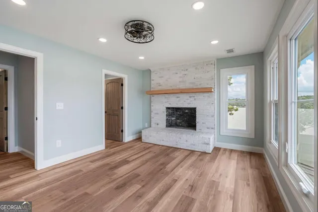 a view of an empty room and glass door