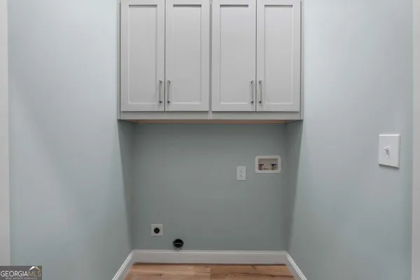 a view of door with washer and dryer