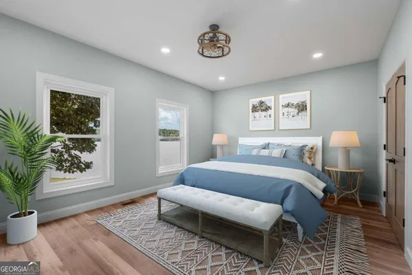 a bed room with a bed and a potted plant