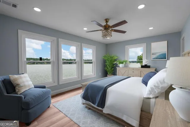 a spacious bedroom with a large bed and a couch