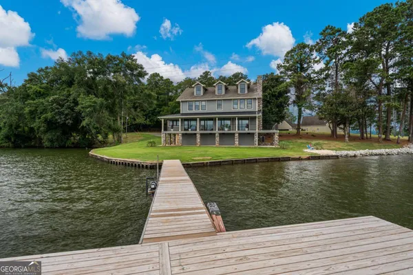 a view of a swimming pool with a lake view