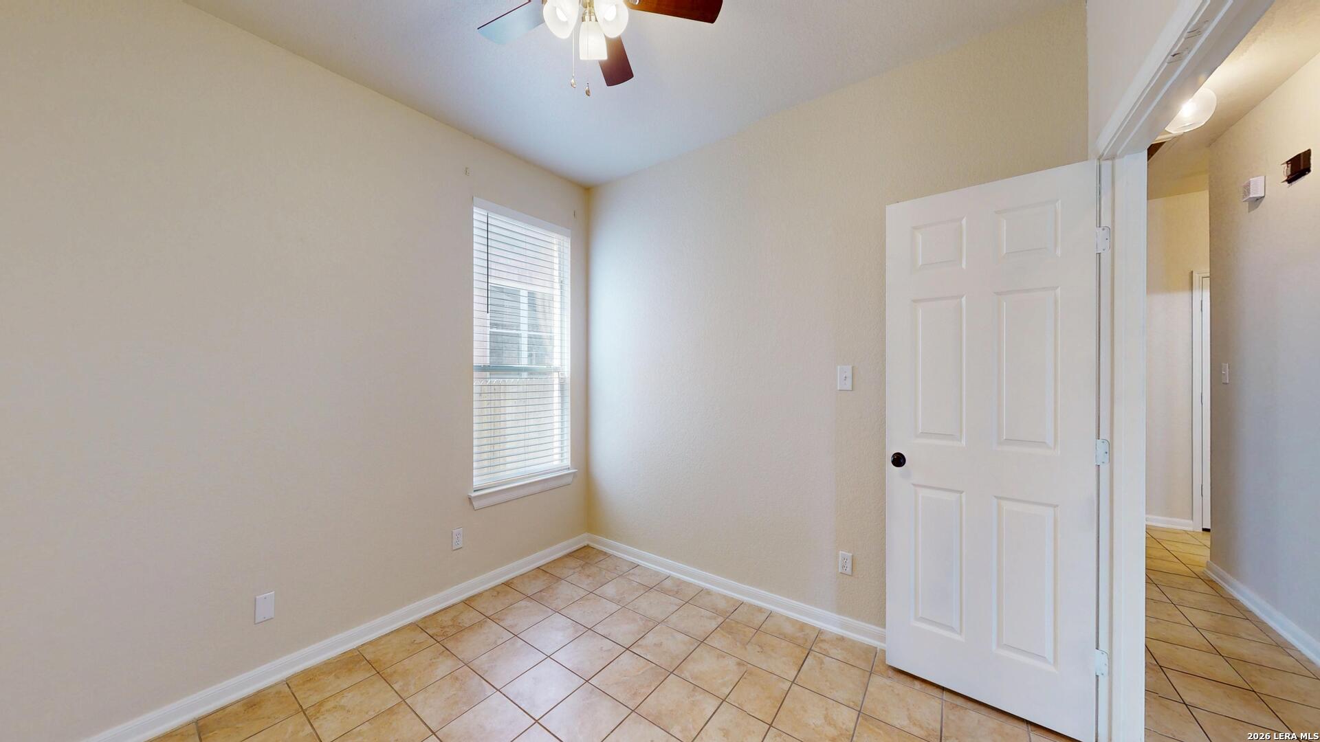 101 Springtree Cliff Cibolo, TX 78108 - Photo 22 of 46 a view of an empty room with window and chandelier fan