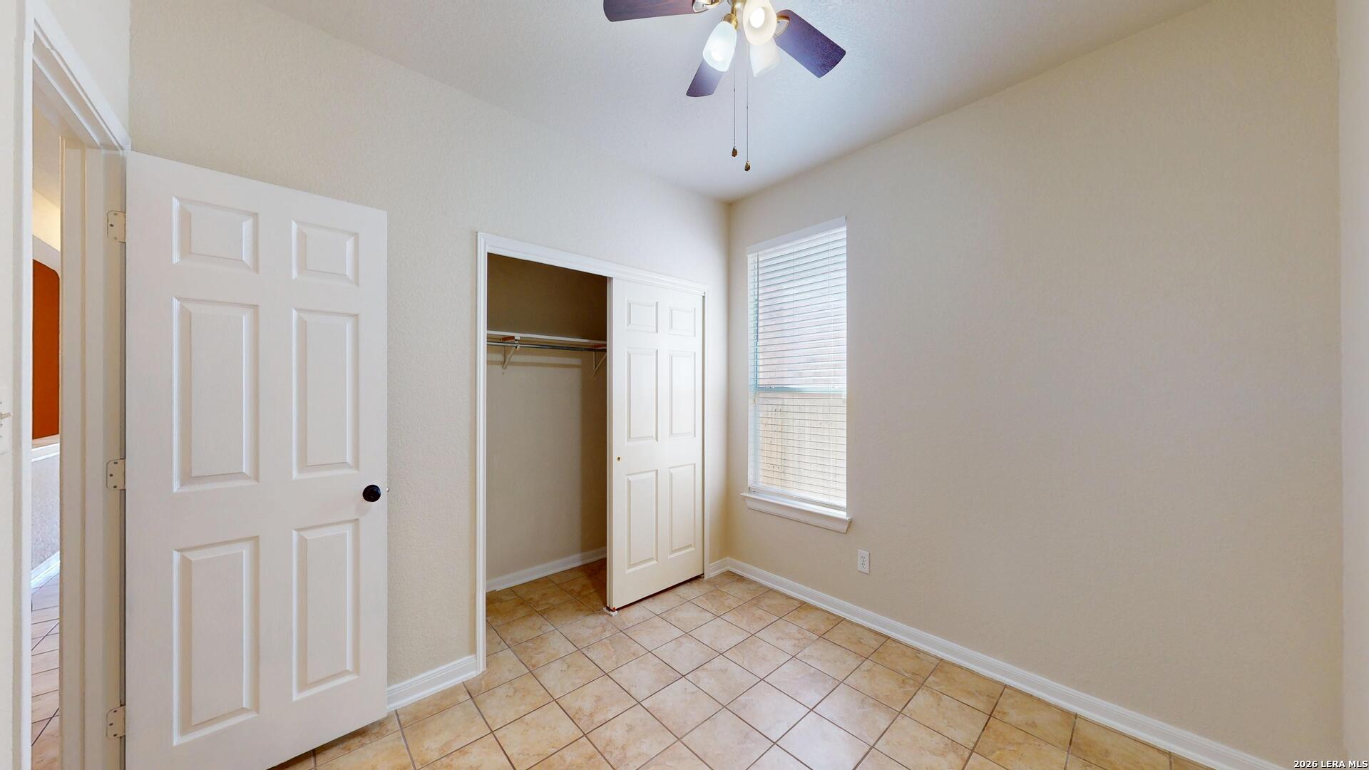 101 Springtree Cliff Cibolo, TX 78108 - Photo 26 of 46 an empty room with windows and closet