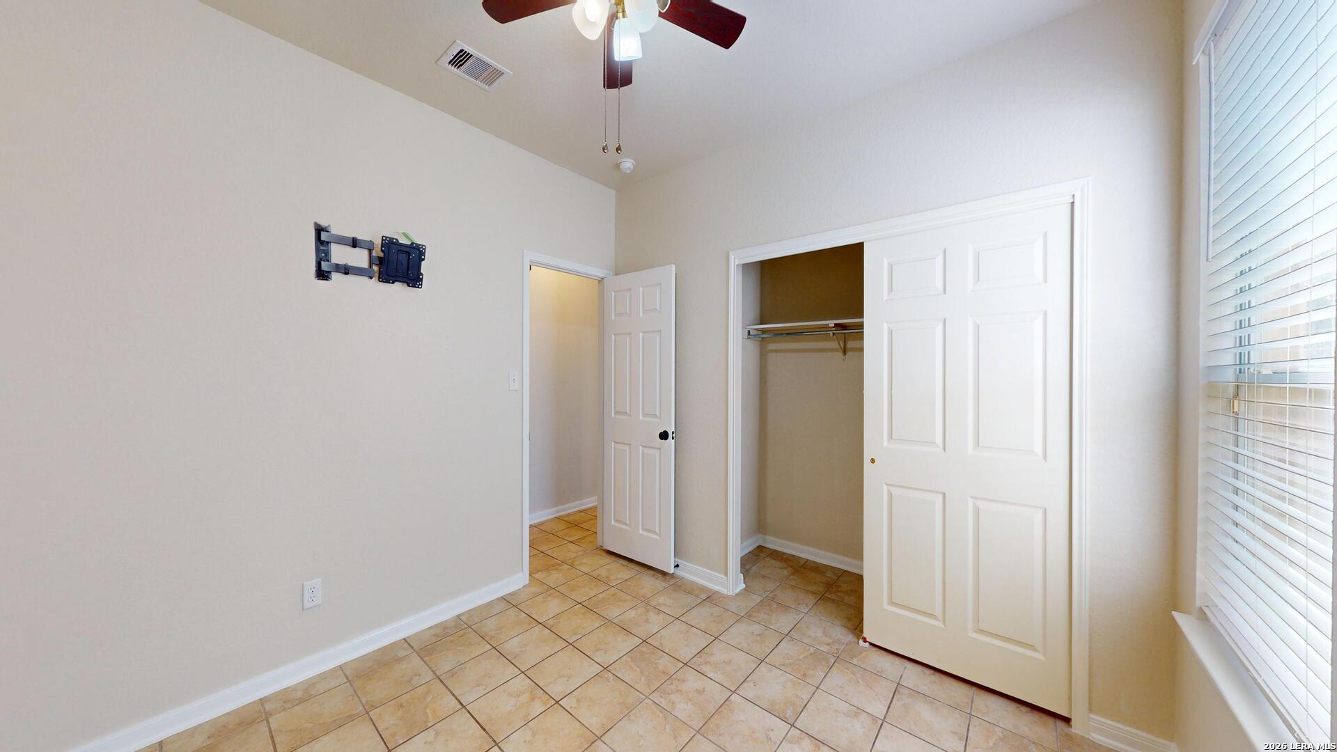 101 Springtree Cliff Cibolo, TX 78108 - Photo 27 of 46 a view of a livingroom with a ceiling fan and window