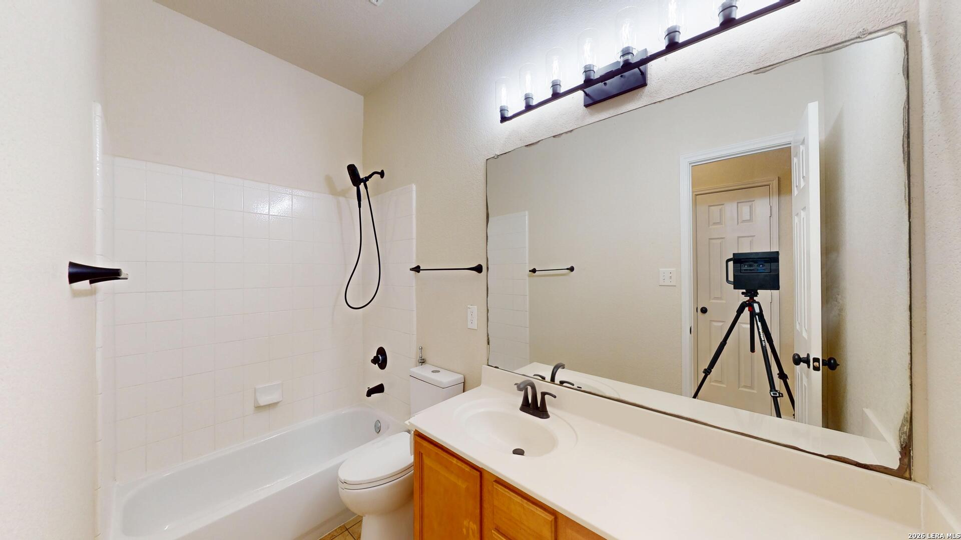 101 Springtree Cliff Cibolo, TX 78108 - Photo 28 of 46 a bathroom with a sink a toilet and shower