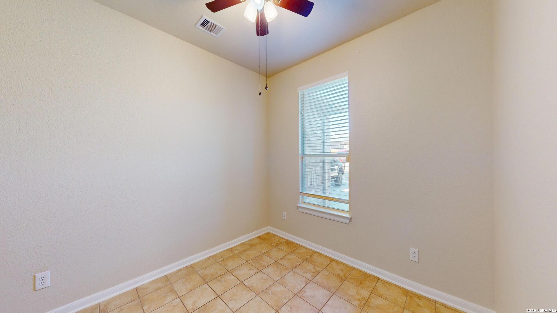 101 Springtree Cliff Cibolo, TX 78108 - Photo 30 of 46 an empty room with windows and fan