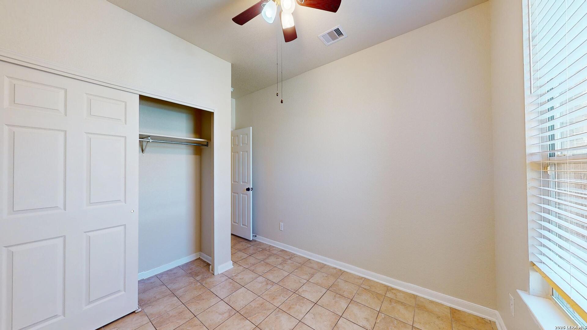 101 Springtree Cliff Cibolo, TX 78108 - Photo 31 of 46 an empty room with windows