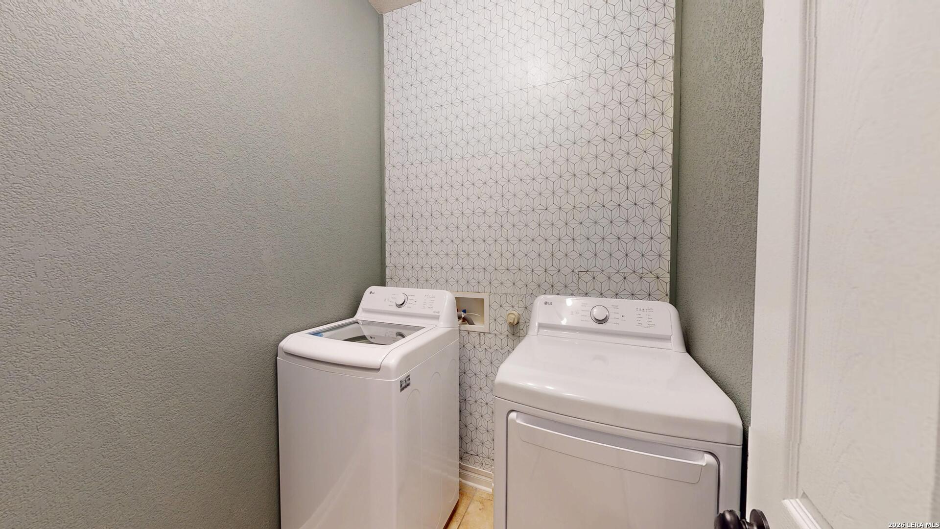 101 Springtree Cliff Cibolo, TX 78108 - Photo 33 of 46 a utility room with dryer and washer