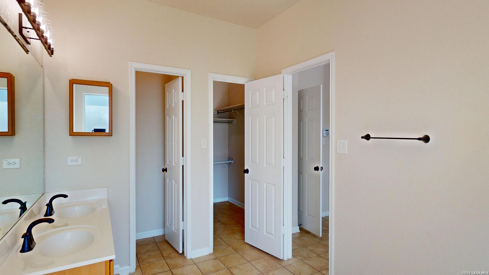 101 Springtree Cliff Cibolo, TX 78108 - Photo 39 of 46 a bathroom with a sink and shower