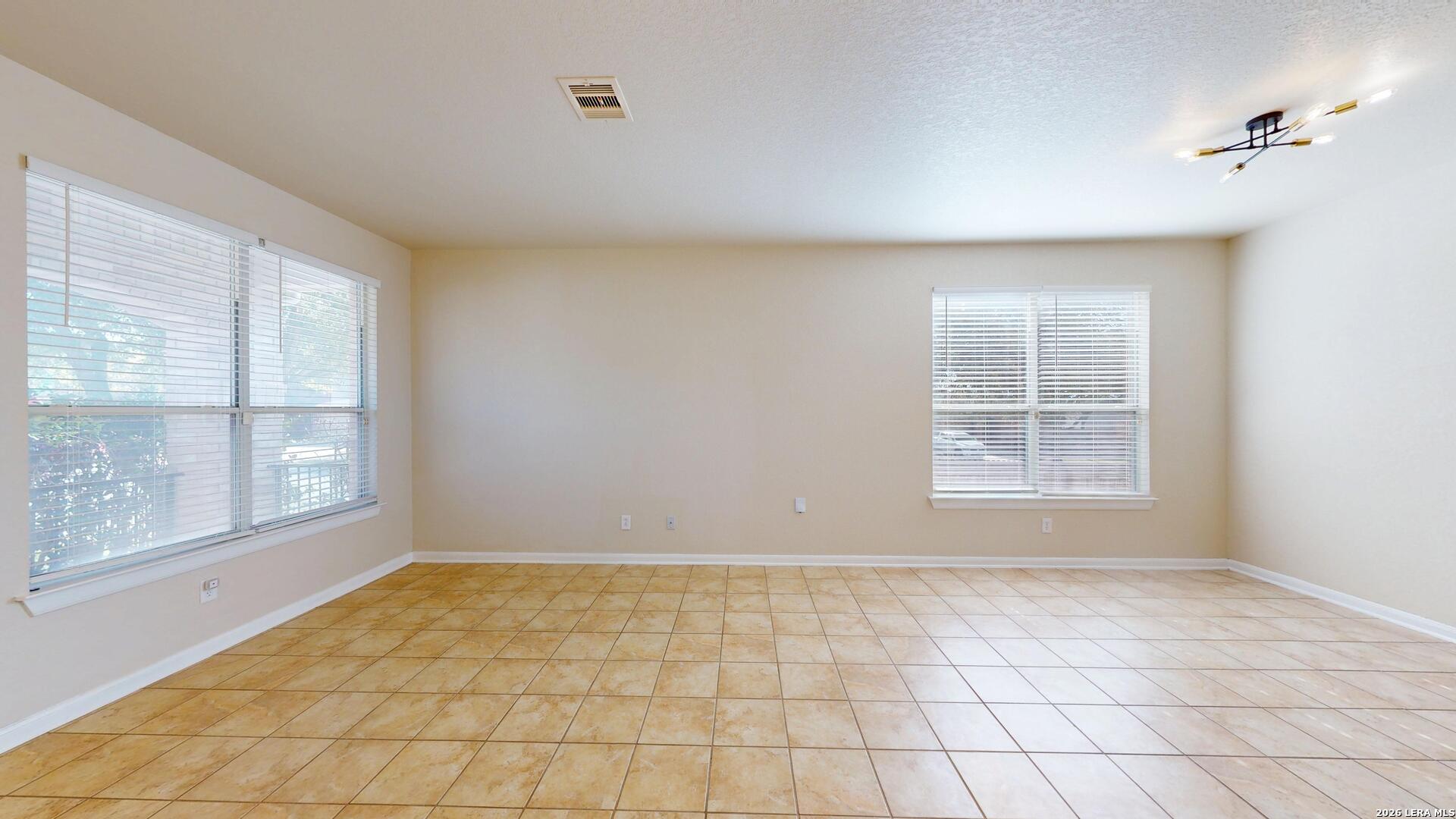 101 Springtree Cliff Cibolo, TX 78108 - Photo 5 of 46 a view of an empty room with a window