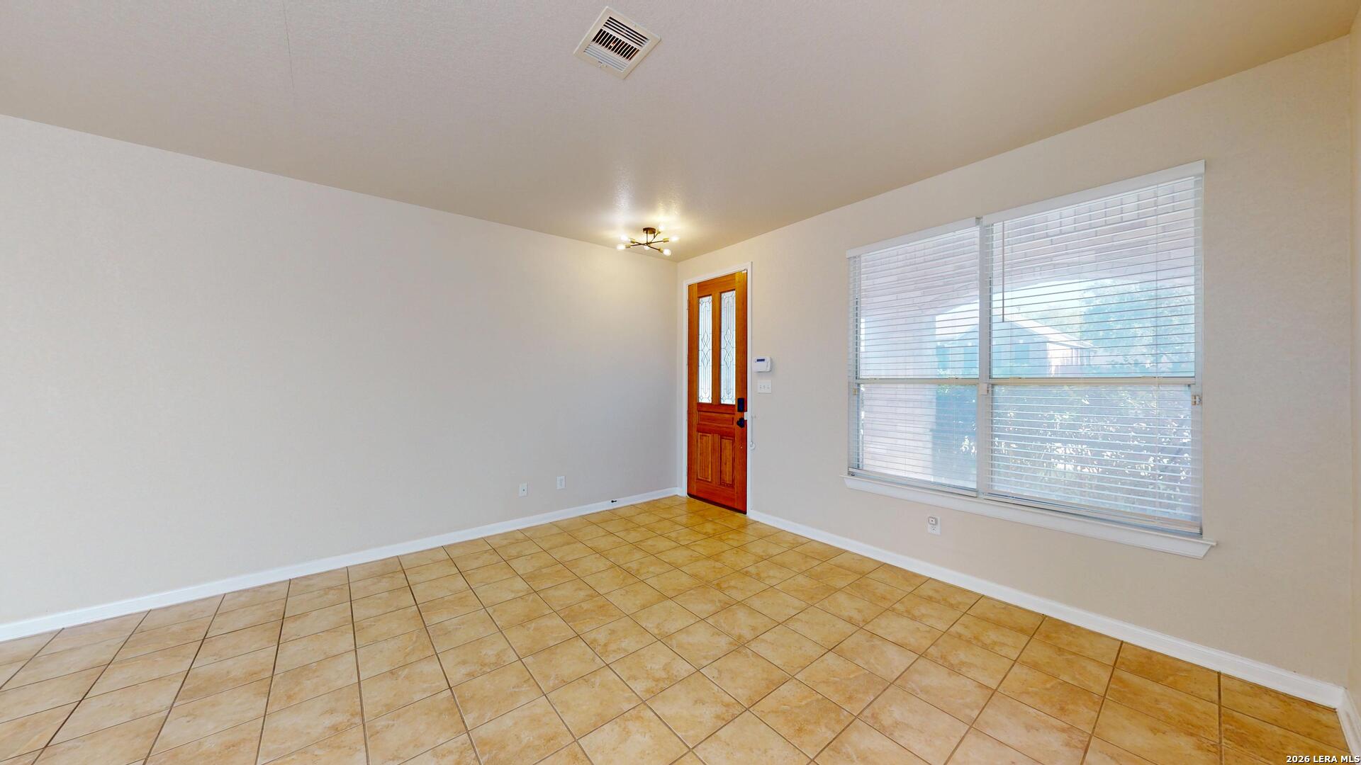 101 Springtree Cliff Cibolo, TX 78108 - Photo 6 of 46 a view of an empty room and window