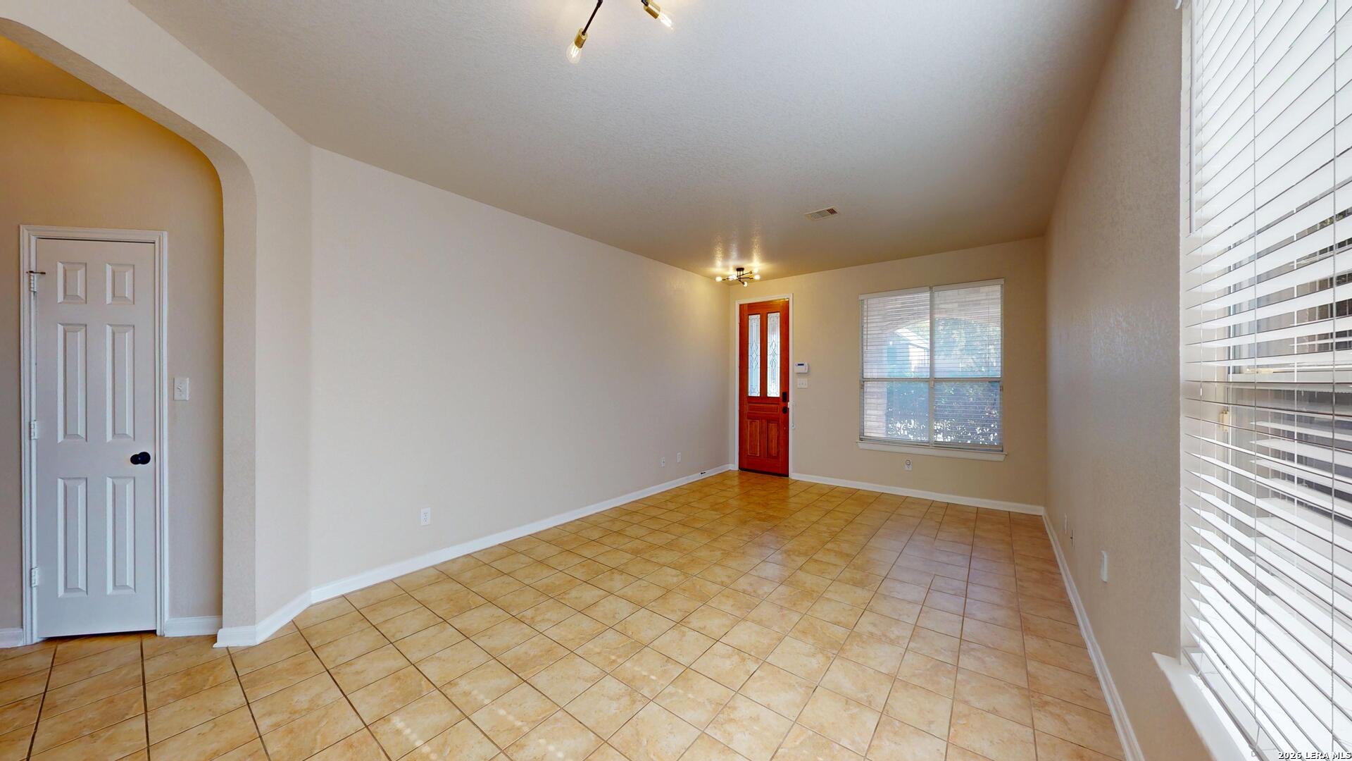 101 Springtree Cliff Cibolo, TX 78108 - Photo 9 of 46 a view of an empty room and window