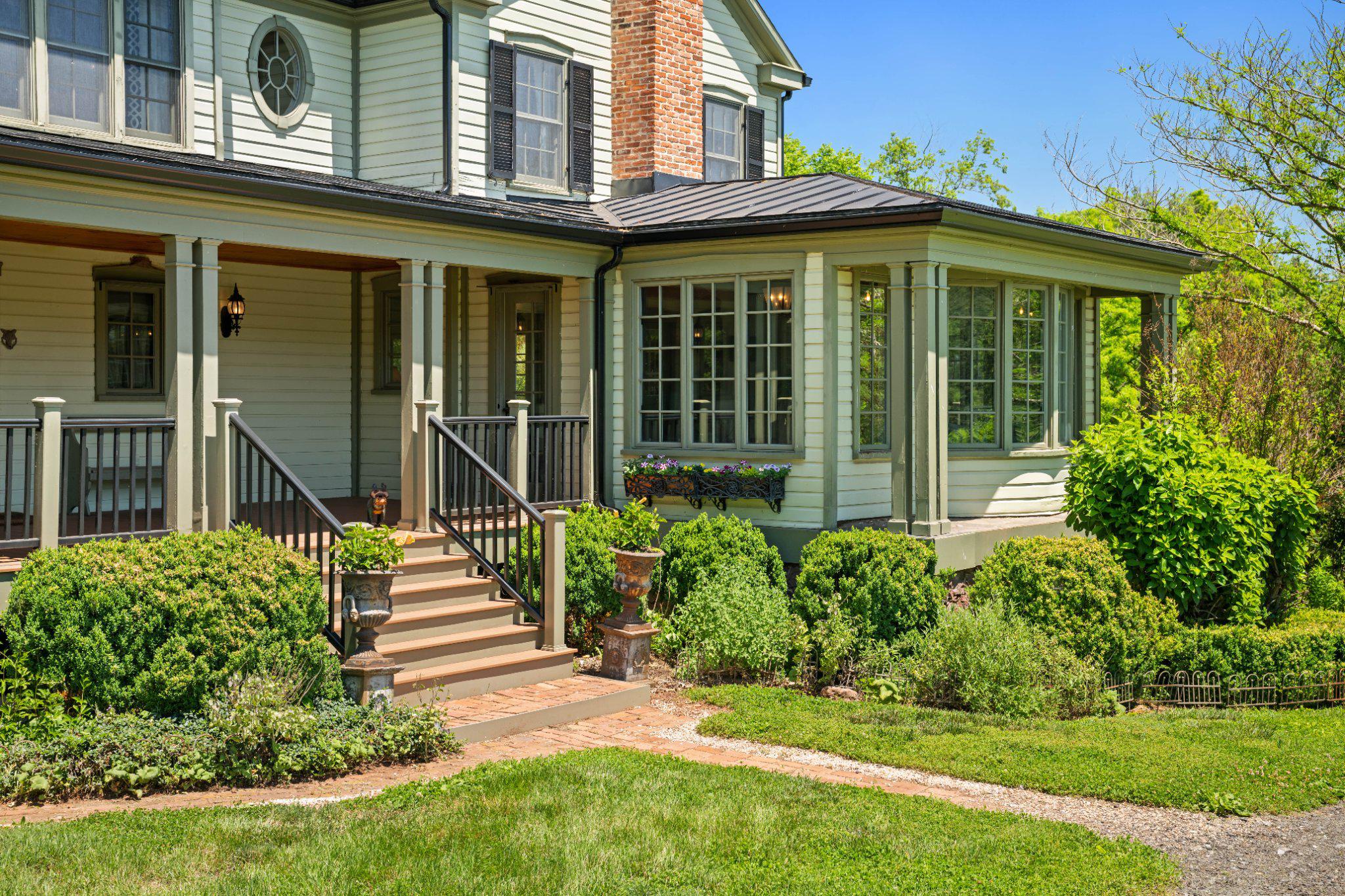 18101 Cattail Road Poolesville, MD 20837 - Photo 58 of 79 Side entrance with hardscape and lush landscaping