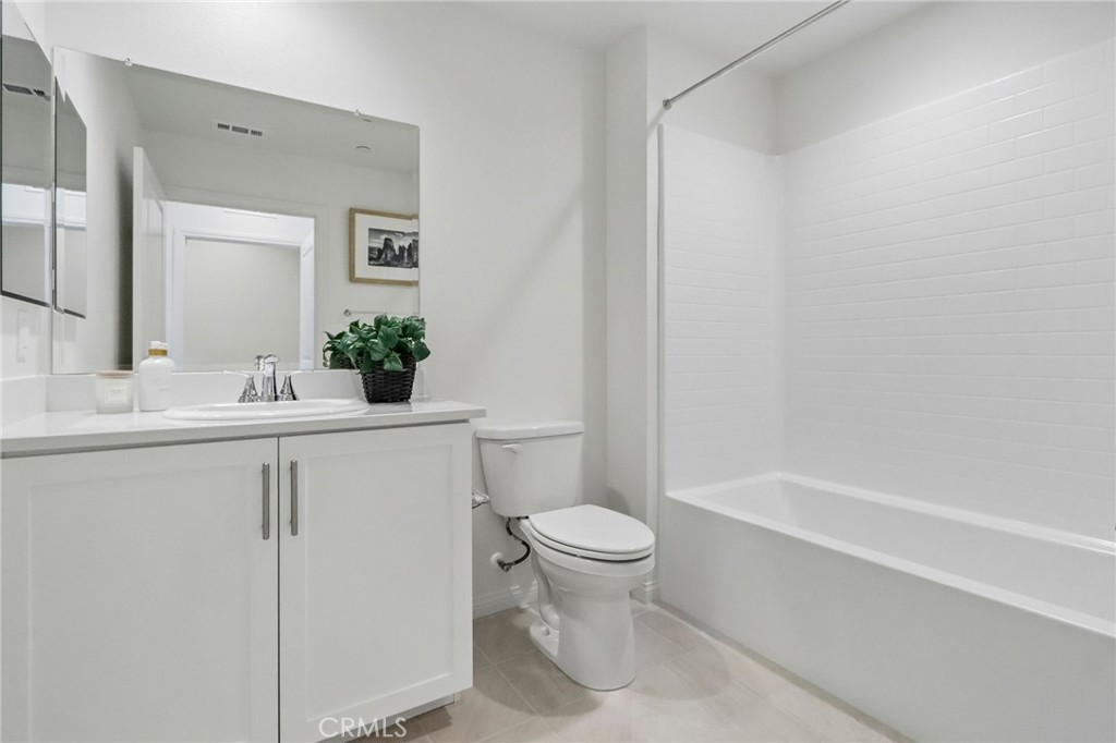 5868 Linden, Unit 6 Long Beach, CA 90805 - Photo 24 of 34 a bathroom with a sink a toilet and shower
