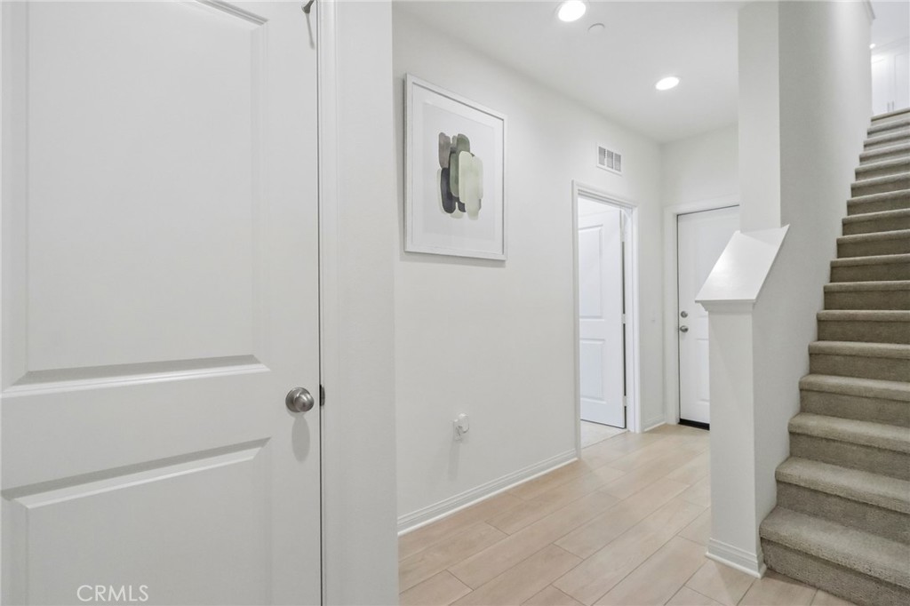 5868 Linden, Unit 6 Long Beach, CA 90805 - Photo 5 of 34 a view of a hallway with wooden floor and entryway