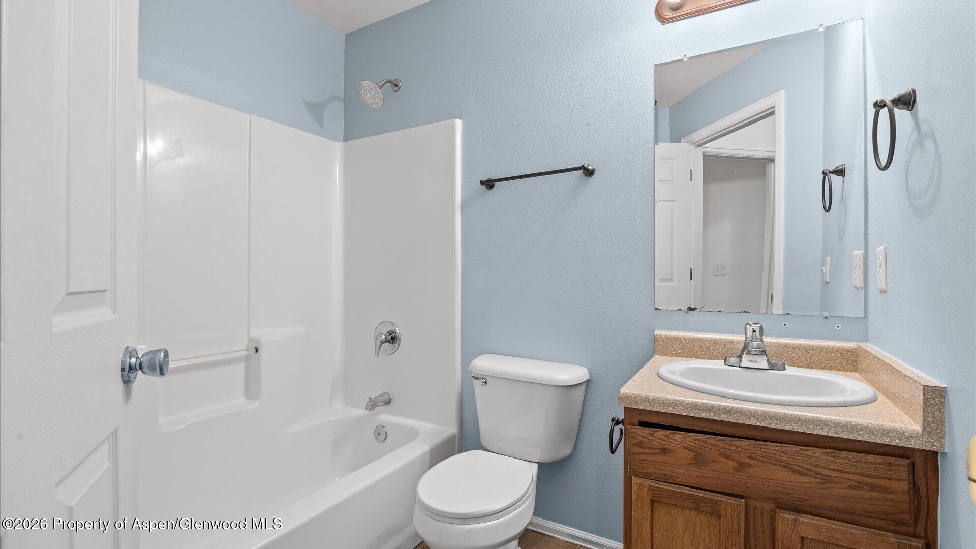 188 Cliff View Circle Parachute, CO 81635 - Photo 30 of 36 a bathroom with a sink toilet and shower
