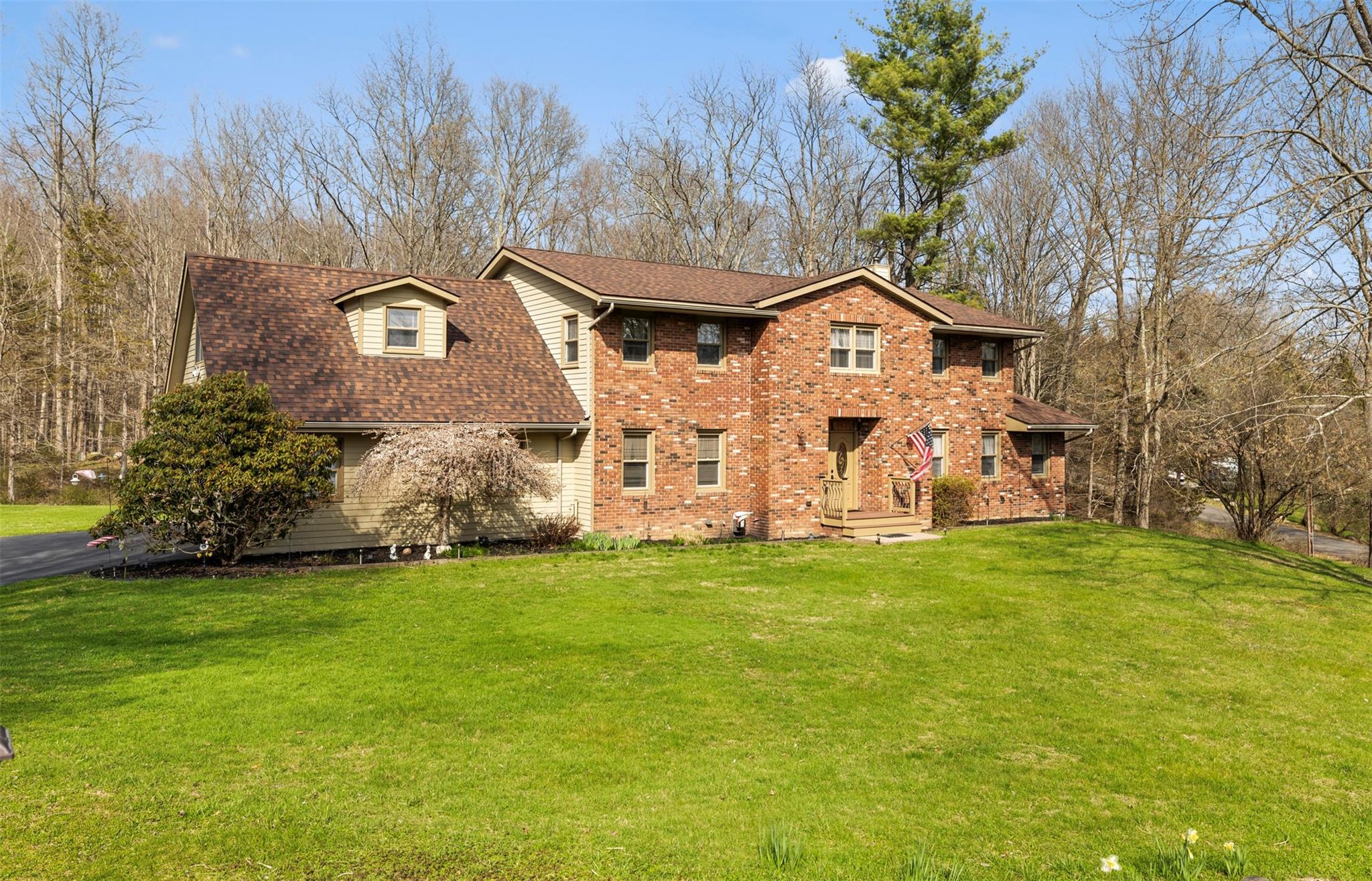 191 Boyce Road Pine Bush, NY 12566 - Photo 1 of 1 View of front facade with roof with shingles, a front lawn, and brick siding