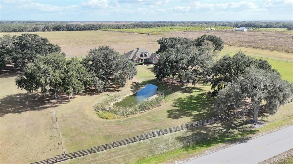 7053 George Marsh Road Zolfo Springs, FL 33890 - Photo 2 of 84 a view of a lake from a yard