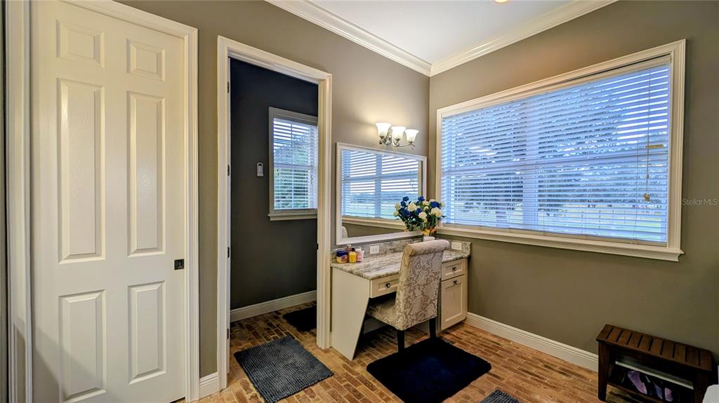 7053 George Marsh Road Zolfo Springs, FL 33890 - Photo 28 of 84 a view of a workspace with furniture and a window