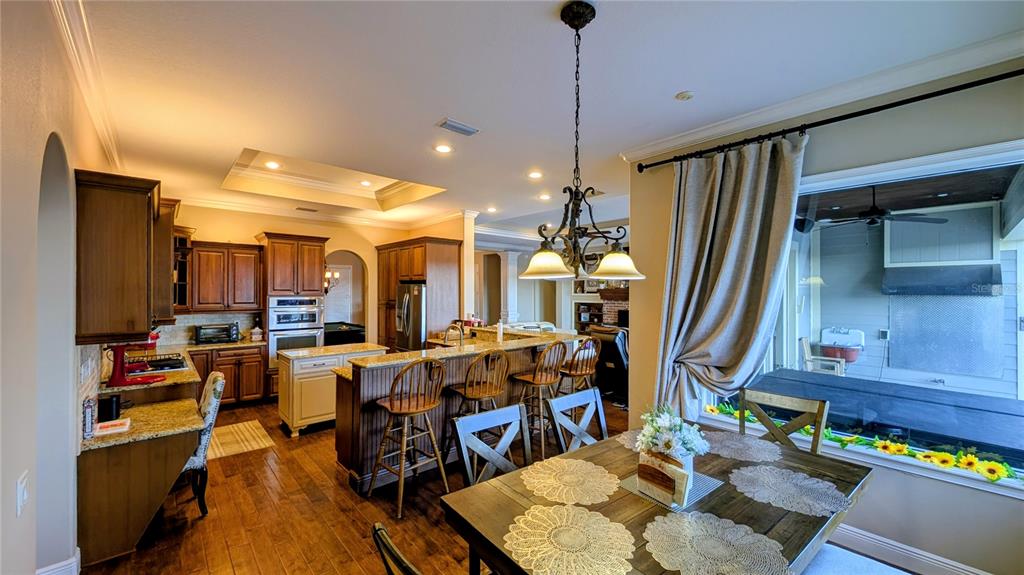 7053 George Marsh Road Zolfo Springs, FL 33890 - Photo 44 of 84 a view of a dining room with furniture window and wooden floor