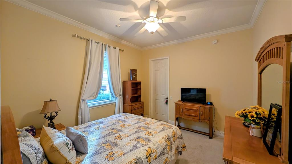 7053 George Marsh Road Zolfo Springs, FL 33890 - Photo 47 of 84 a bedroom with a bed and a flat screen tv