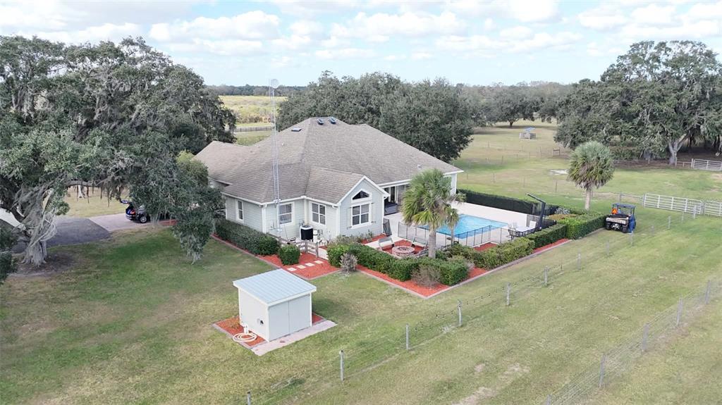7053 George Marsh Road Zolfo Springs, FL 33890 - Photo 59 of 84 an aerial view of a house with a garden