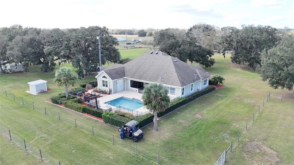 7053 George Marsh Road Zolfo Springs, FL 33890 - Photo 72 of 84 a aerial view of a house with table and chairs
