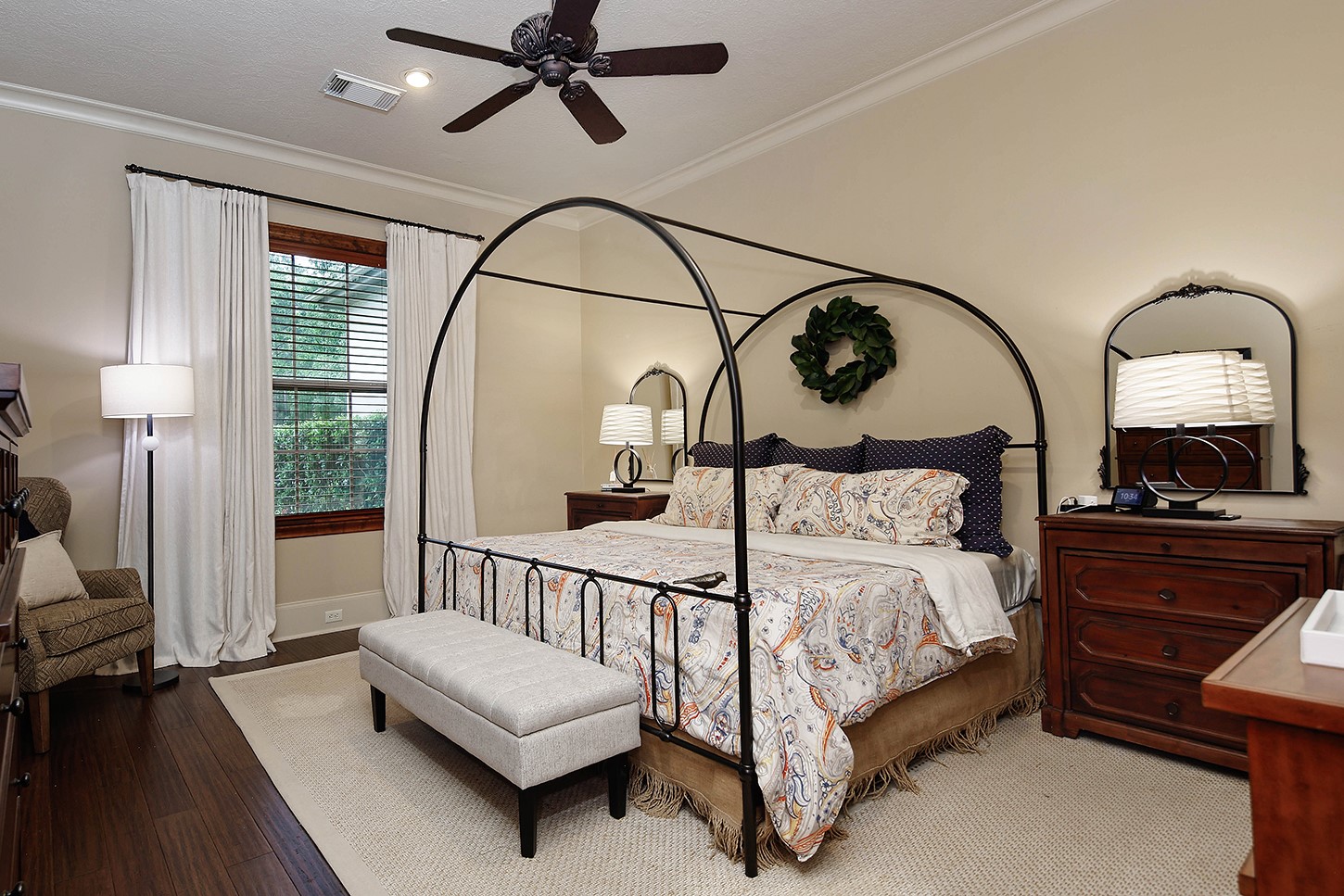 119 Angel Leaf Road The Woodlands, TX 77380 - Photo 33 of 50 a bedroom with bed and a chandelier