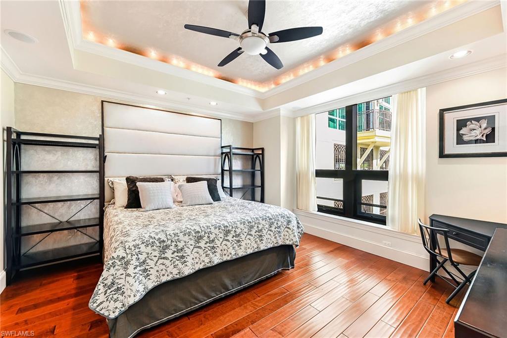 9115 Strada Place, Unit 5201 Naples, FL 34108 - Photo 13 of 22 a bedroom with a bed closet and window