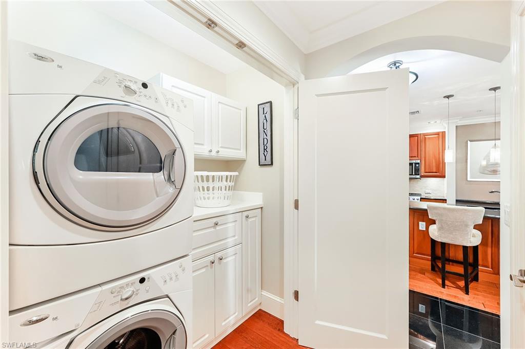 9115 Strada Place, Unit 5201 Naples, FL 34108 - Photo 19 of 22 a utility room with dryer and washer
