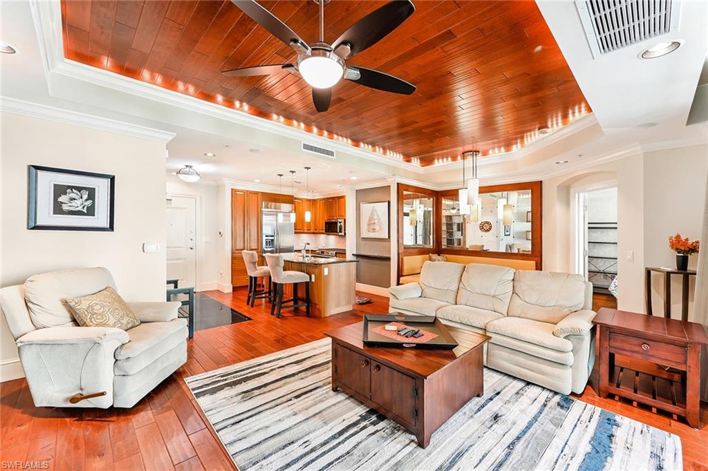 9115 Strada Place, Unit 5201 Naples, FL 34108 - Photo 2 of 22 a living room with furniture and a large window
