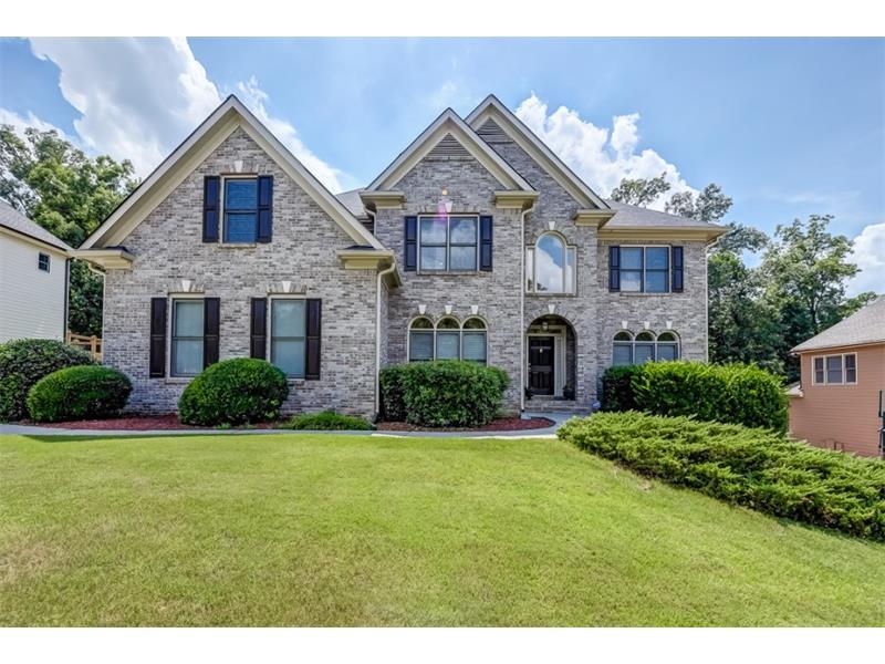 Brick beauty in sought after Morningview- Suwanee's premiere swim- tennis- play community!