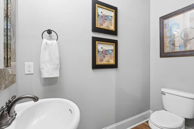 a bathroom with a toilet and a sink