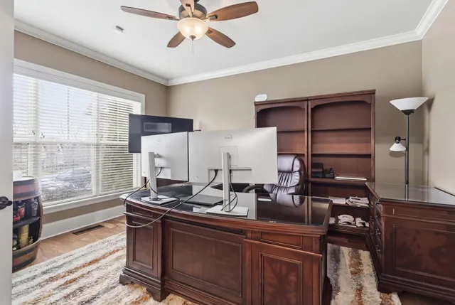 a kitchen with a refrigerator and a sink