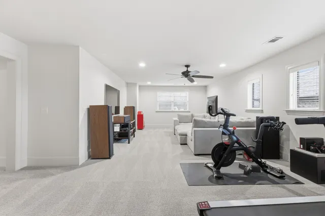 a living room with furniture a dining table and a stove top oven