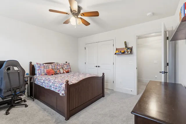 a room with a bed and furniture