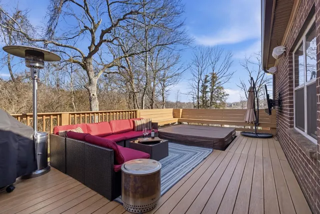 a view of a backyard with sitting area