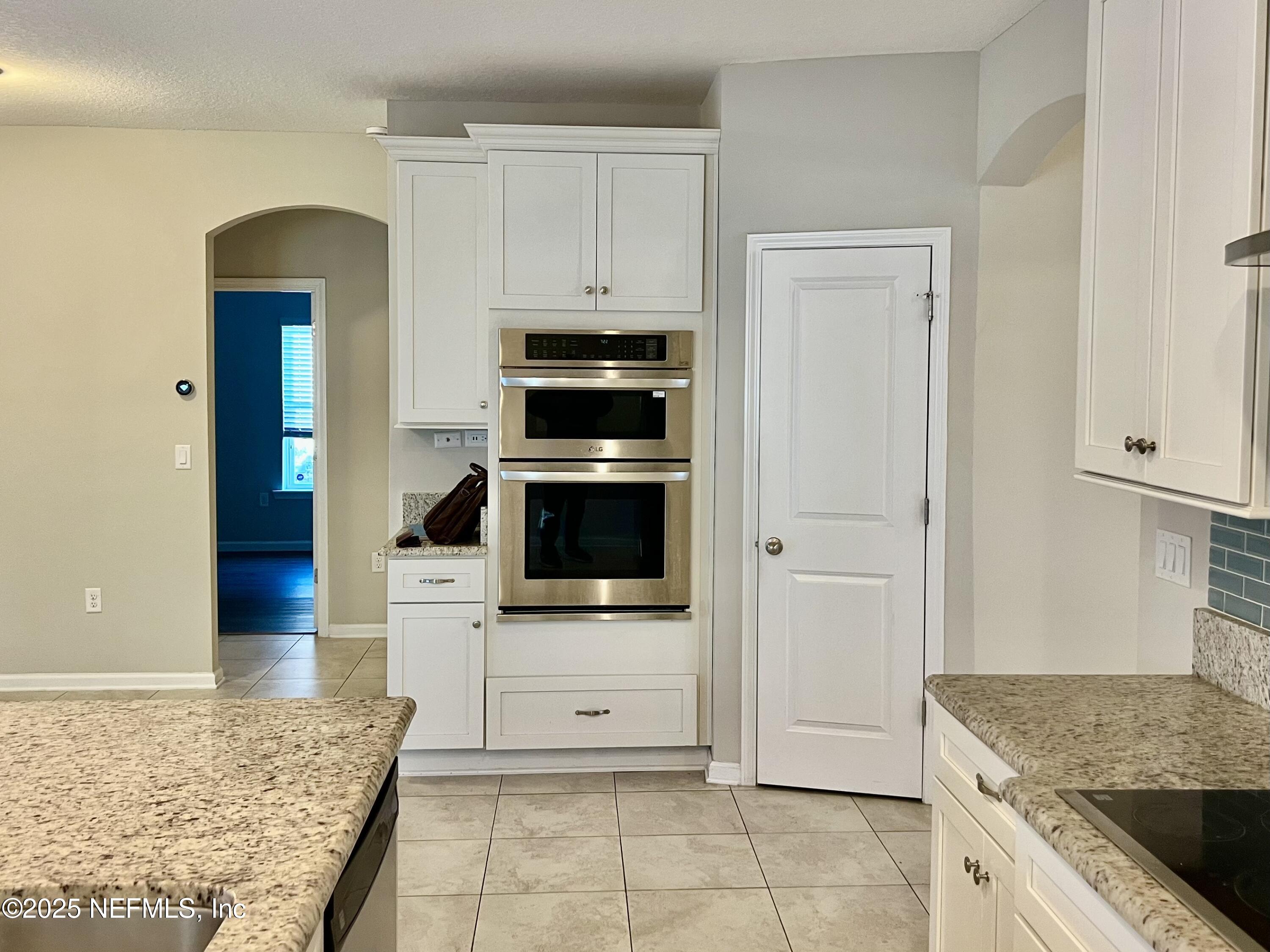 85806 Black Tern Drive Yulee, FL 32097 - Photo 13 of 38 a kitchen with stainless steel appliances granite countertop a stove and a sink
