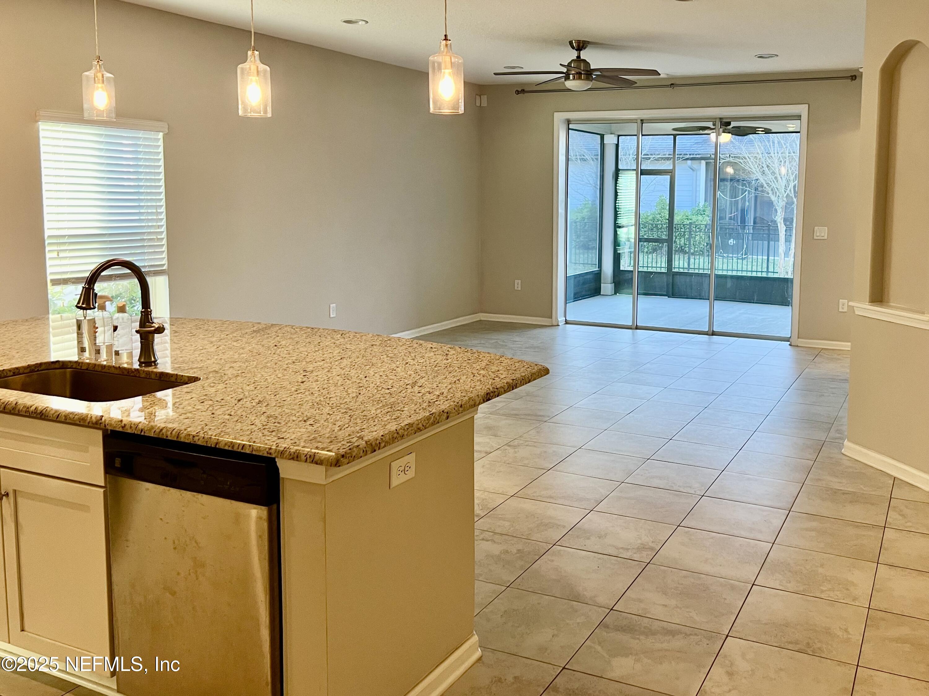 85806 Black Tern Drive Yulee, FL 32097 - Photo 14 of 38 a kitchen with granite countertop a sink and a stove