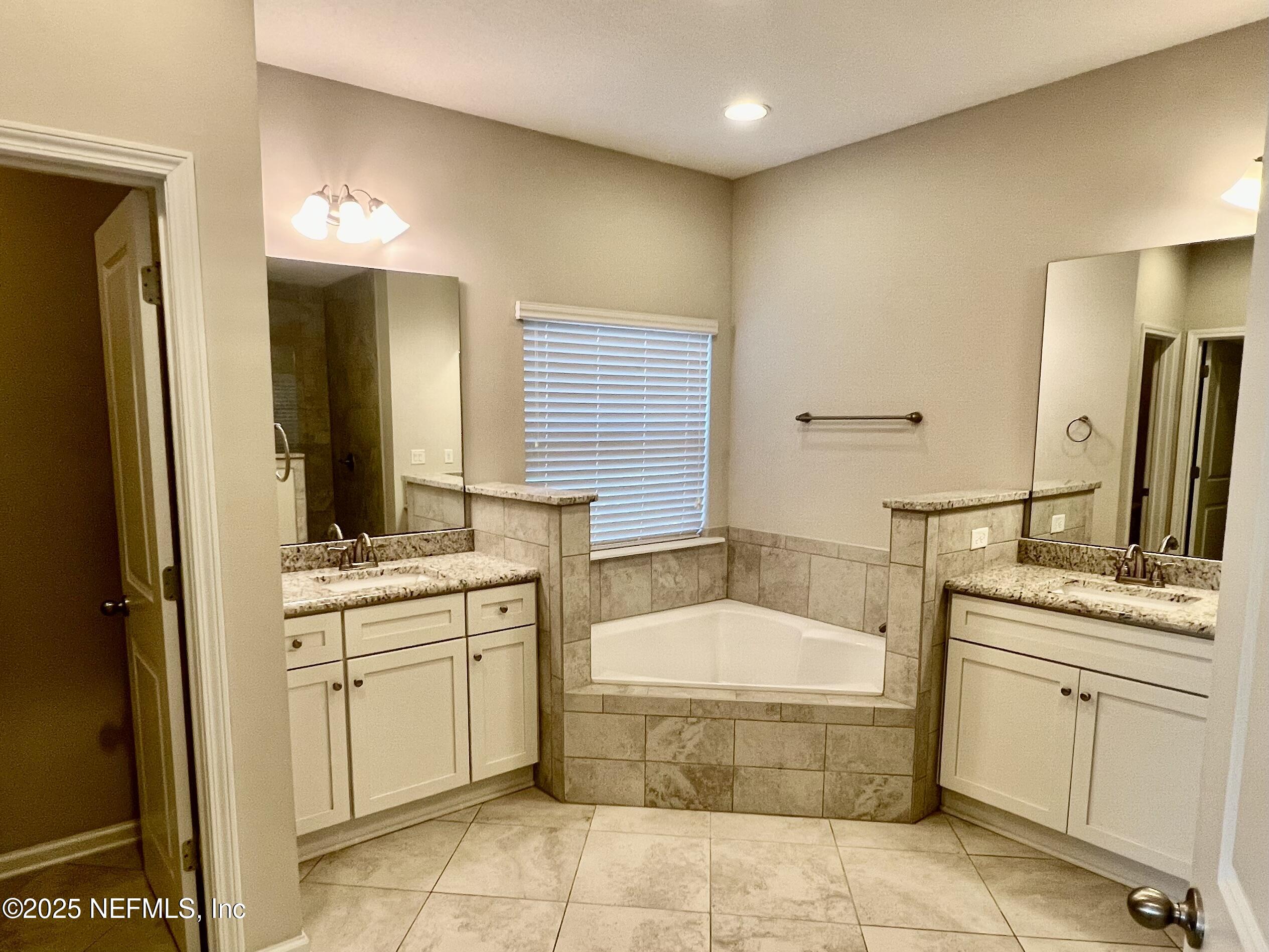 85806 Black Tern Drive Yulee, FL 32097 - Photo 22 of 38 a bathroom with a sink toilet and mirror