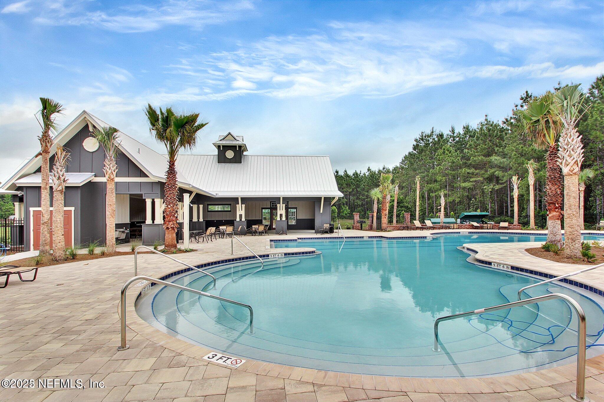 85806 Black Tern Drive Yulee, FL 32097 - Photo 32 of 38 a view of a house with swimming pool and sitting area