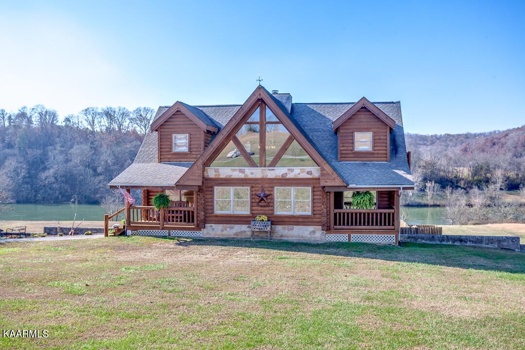 2030 Holston River Drive Rutledge, TN 37861 - Photo 1 of 53 a front view of a house with a yard