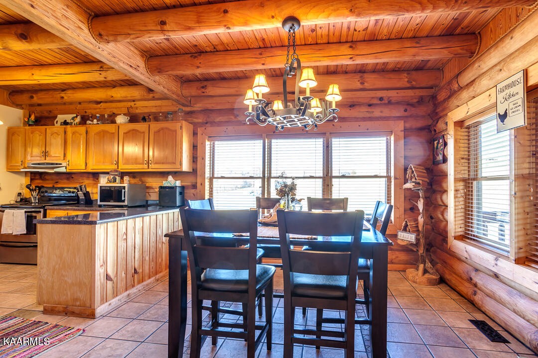 2030 Holston River Drive Rutledge, TN 37861 - Photo 12 of 53 a view of a dining room with furniture wooden floor and chandelier