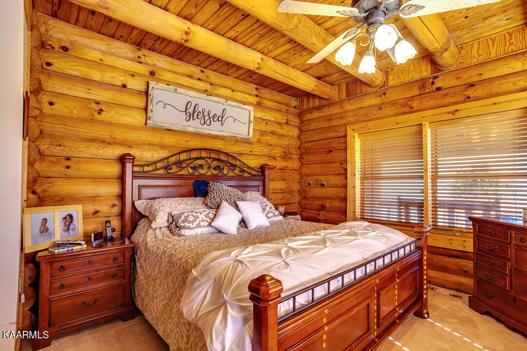 2030 Holston River Drive Rutledge, TN 37861 - Photo 18 of 53 a bedroom with a bed and a dresser