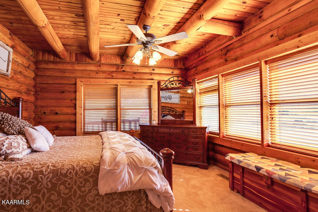 2030 Holston River Drive Rutledge, TN 37861 - Photo 19 of 53 a bedroom with a bed and a balcony