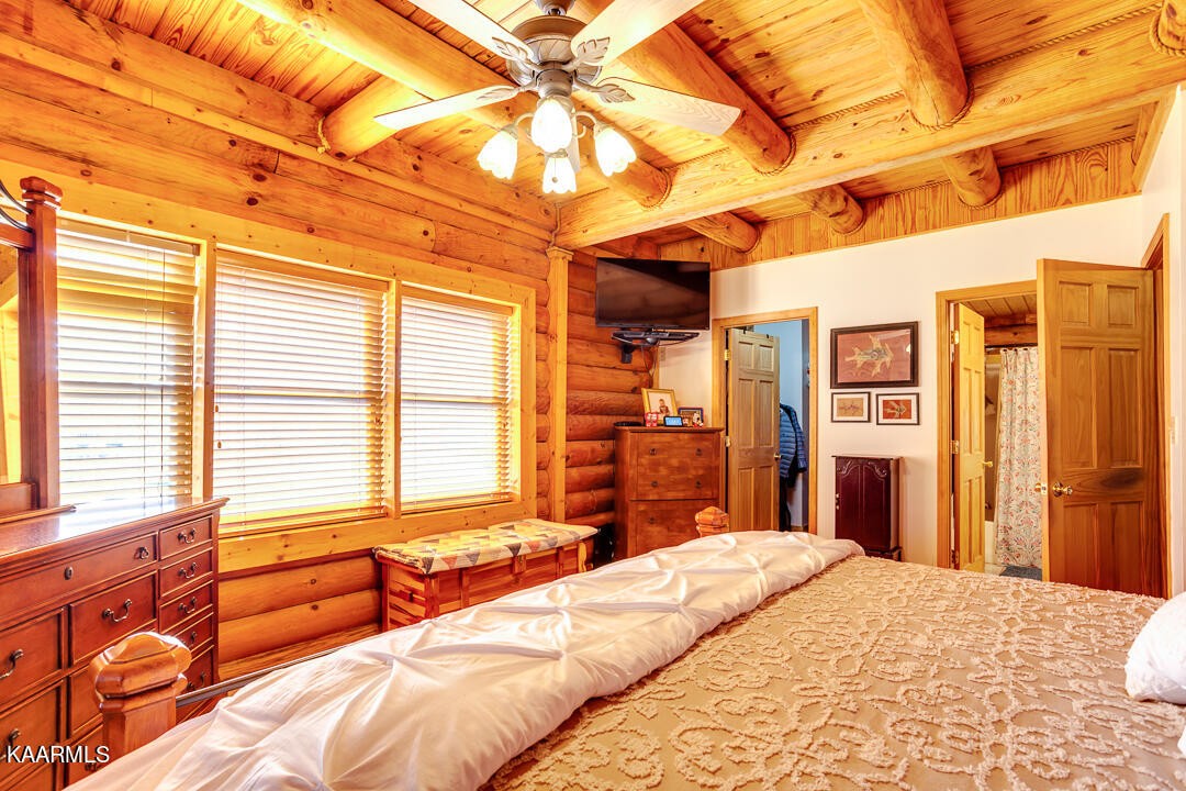 2030 Holston River Drive Rutledge, TN 37861 - Photo 20 of 53 a bedroom with a bed next to a window