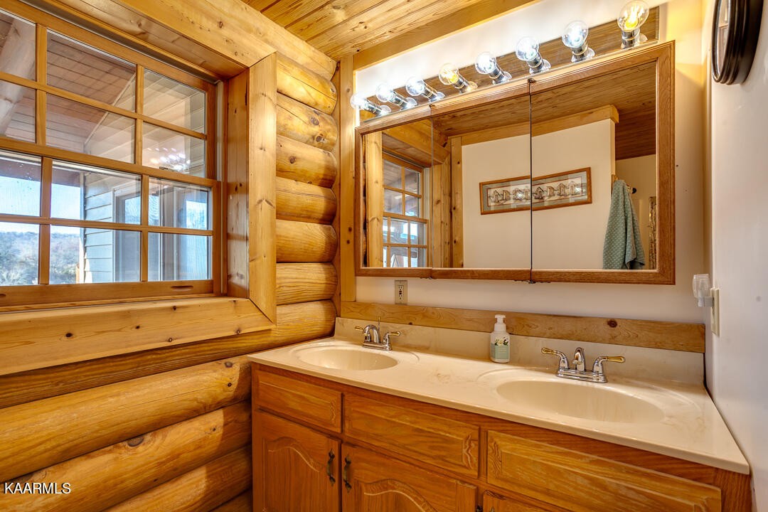 2030 Holston River Drive Rutledge, TN 37861 - Photo 22 of 53 a bathroom with a sink and a mirror