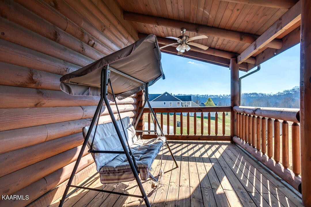 2030 Holston River Drive Rutledge, TN 37861 - Photo 34 of 53 a view of a balcony with furniture and wooden floor