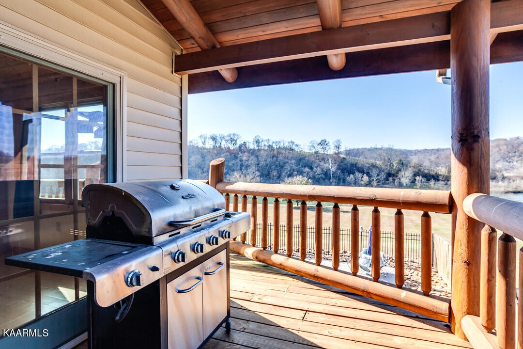2030 Holston River Drive Rutledge, TN 37861 - Photo 35 of 53 a view of a balcony with chairs and wooden floor