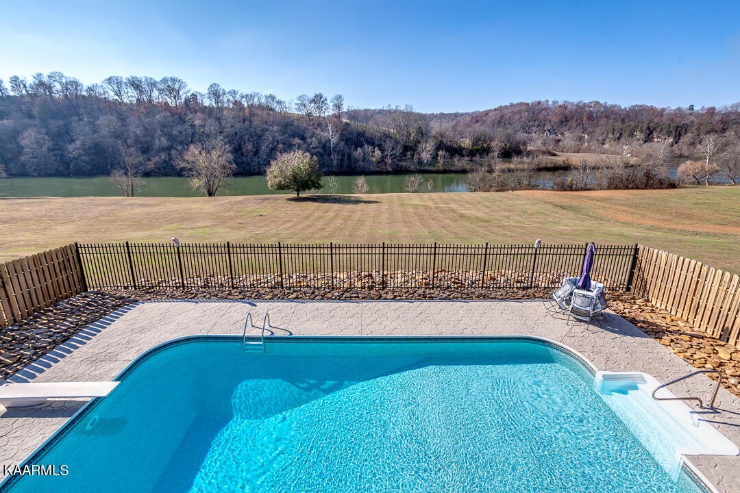 2030 Holston River Drive Rutledge, TN 37861 - Photo 36 of 53 a view of a swimming pool with a lake view